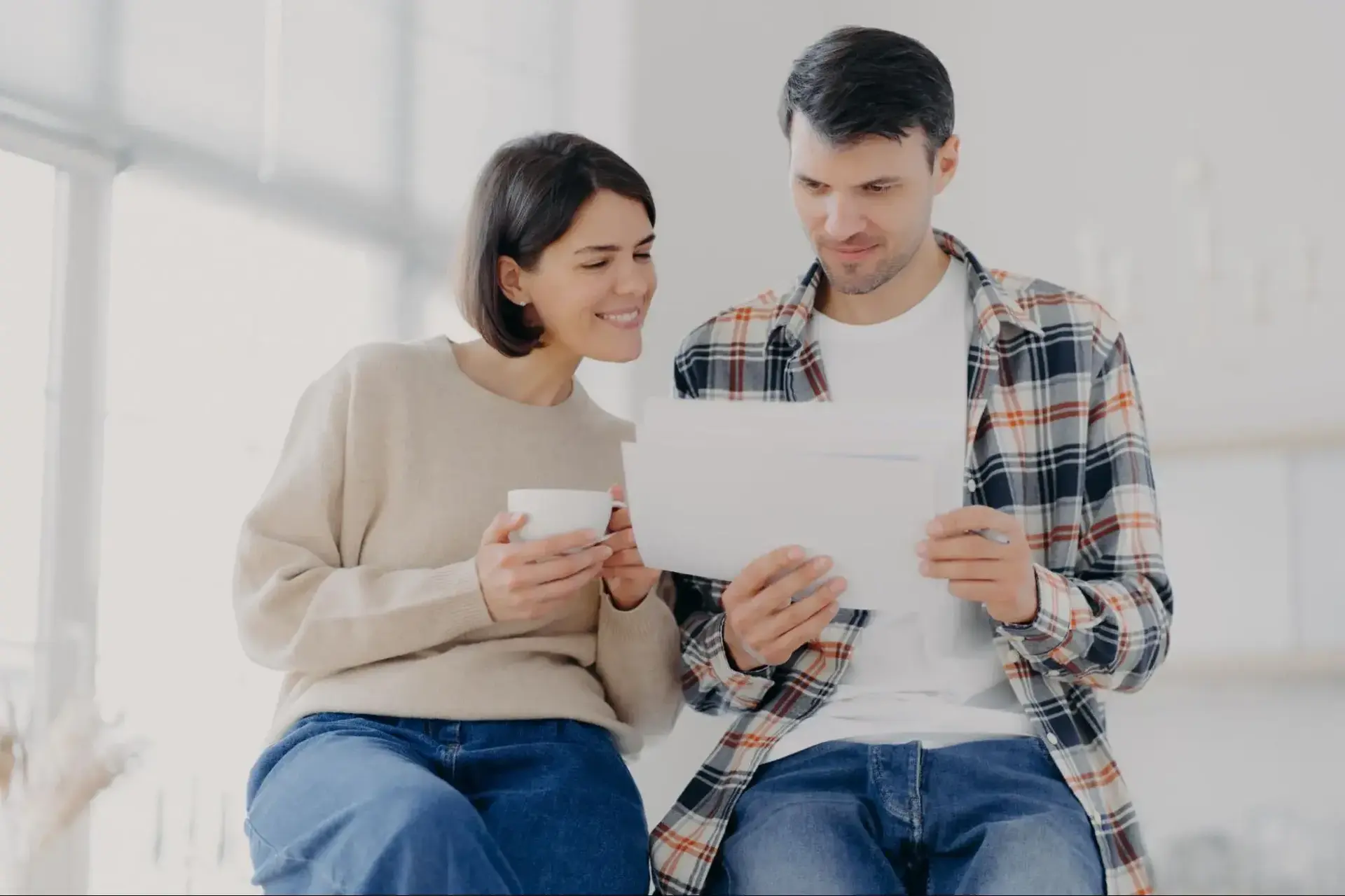 Couple reading about what is good eye pressure